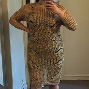 Copper colored distressed sweater.